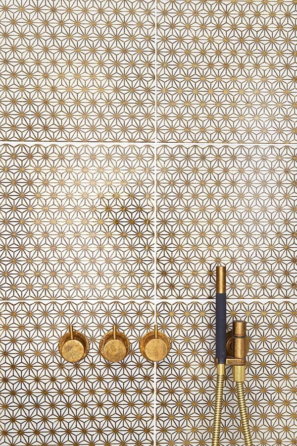 Hand glazed patterned Komon Golden-Ochre K11 lava stone tiles shower by Made a Mano
